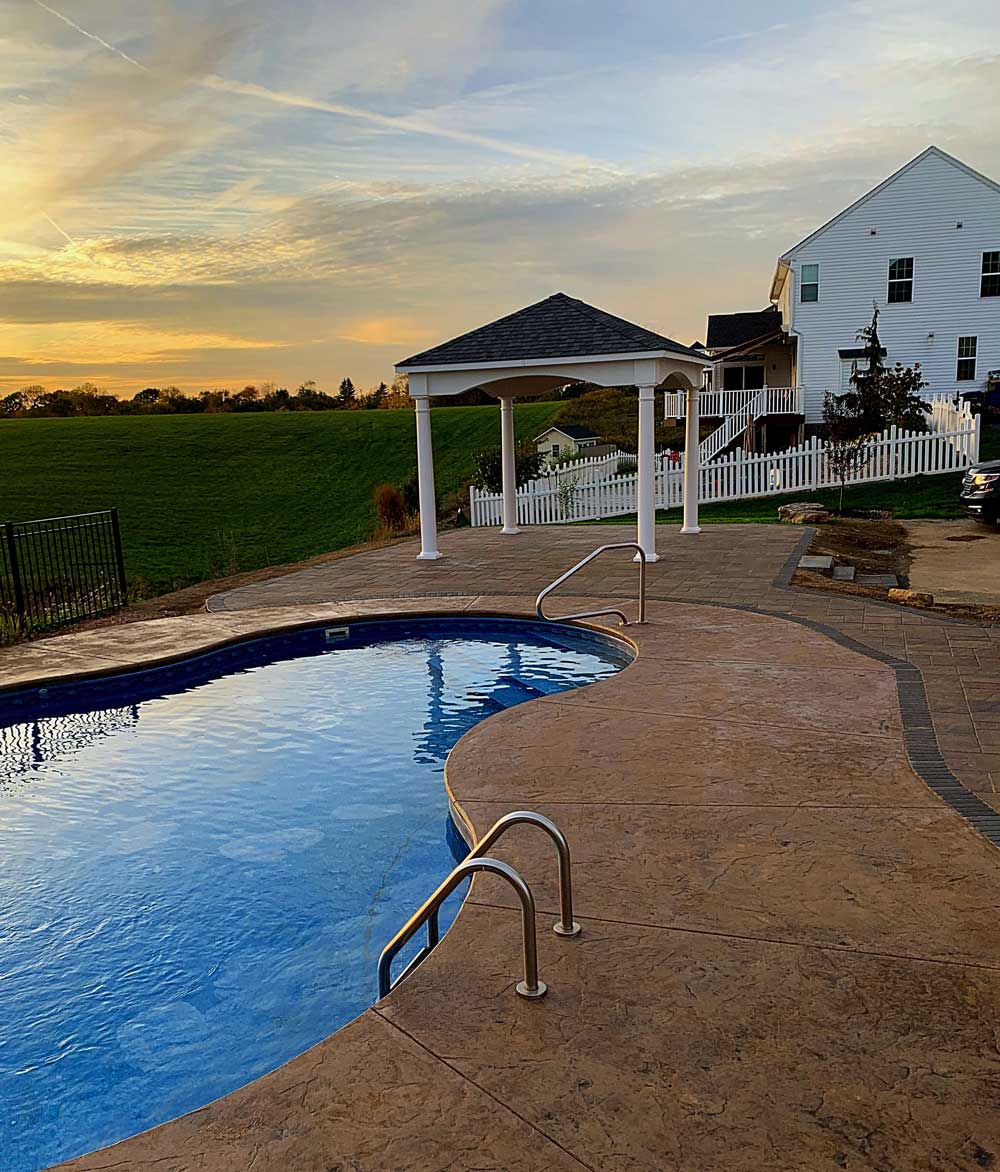 Outdoor pool next to house