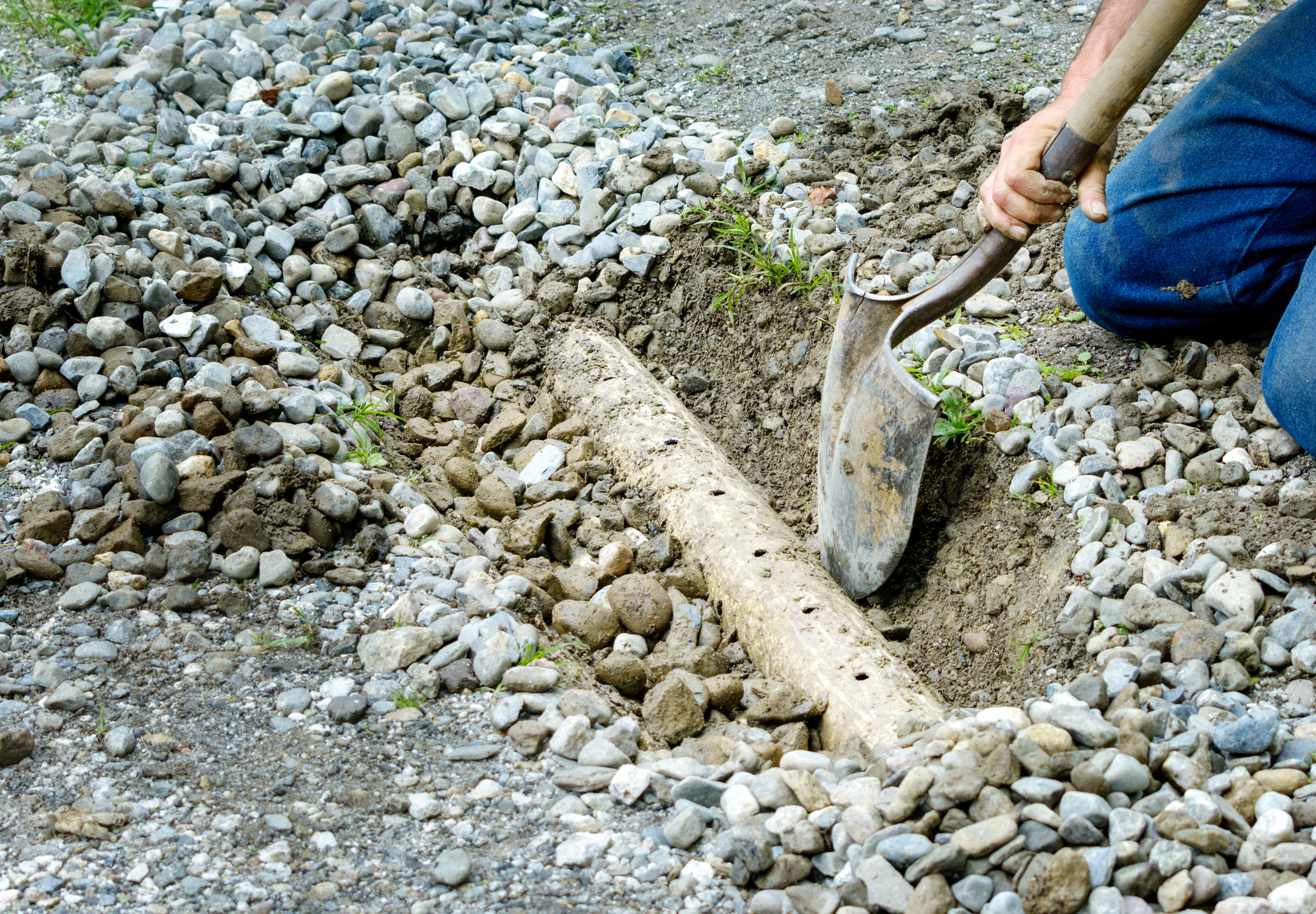 Man installing drainage